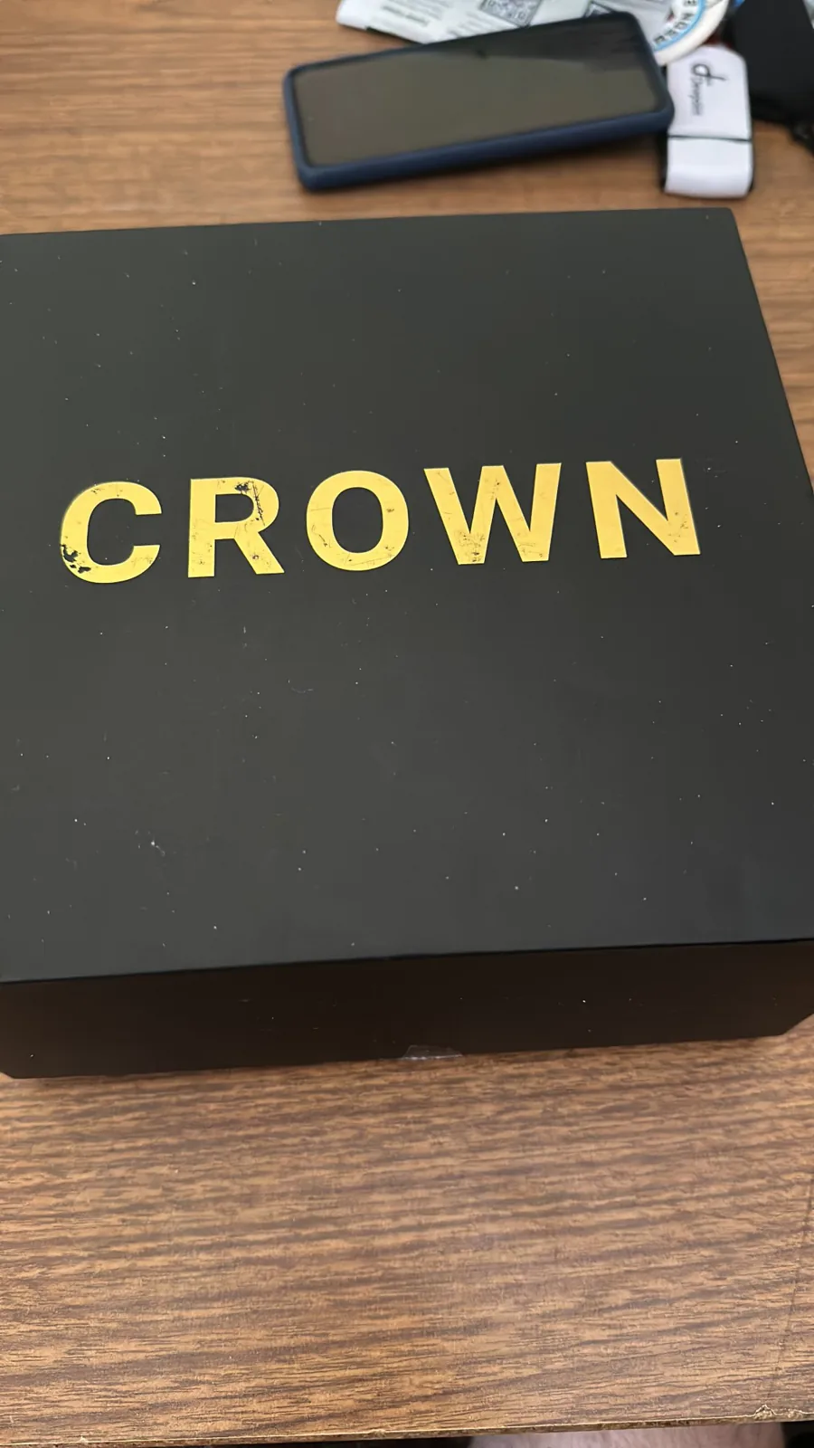The Neurosity Crown's black box with CROWN in gold letters
